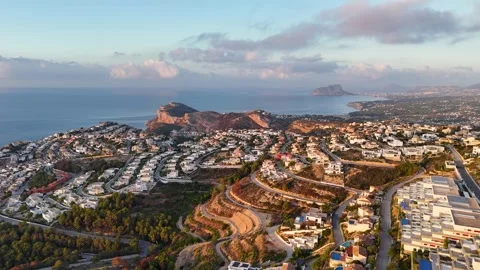 Aerial view of Cumbre del Sol residential development with Calpe coastline 動画素材 337028457