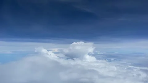 Aerial View of Cumulus Clouds Over Deep Blue Sky Stock Footage 339791596
