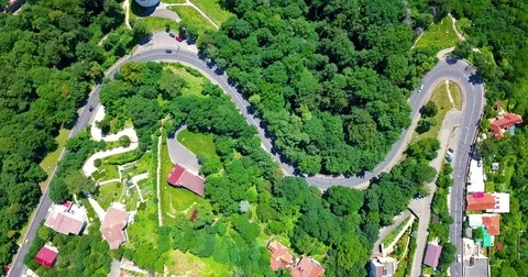 Aerial View Of Curved Roads In Carpathian Mountains Forest Of Transylvania Stock Footage