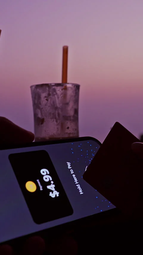 Aerial view Customer Paying With Tap To Pay on IPhone Using Contactless Bank Car Stock Footage 330653410