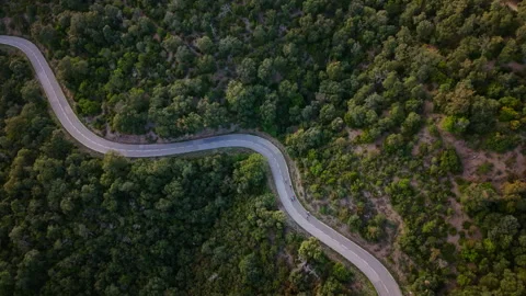 Aerial view of cyclists riding on mountain road in Santa Pellaia, Girona. Stock Footage 333483636