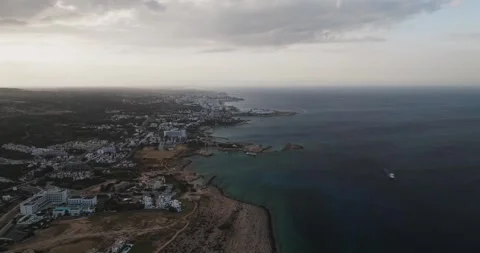 Aerial view of Cyclops Cave and coastal town, Cyprus. Stock Footage 312839550