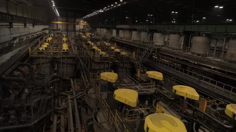 Aerial view of cylindrical froth flotation cells in the metallurgical plant, 4K Stock Footage