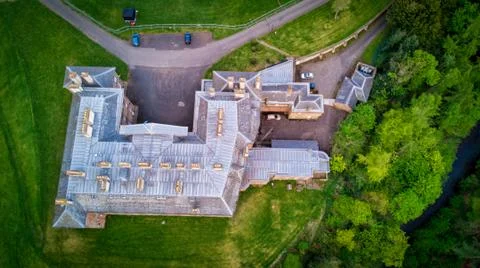 Aerial view of Dalkeith Palace amidst green fields and trees Stock Photos