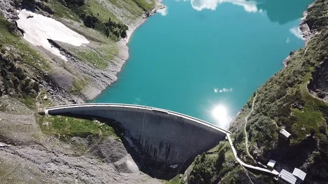 Aerial view of the dam of an Alpine artificial lake. Italian Alps. Italy Stock Footage 91658057