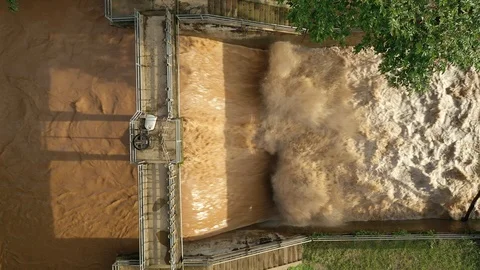 Aerial view of the dam and there is severe water flow Stock Footage 114754595