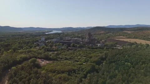 Aerial view of Danube Cement Works in Vác beside the Danube River and hills Stock Footage 346674992