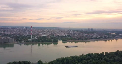 Aerial view of Danube river and a passing cargo ship Stock Footage 166079972