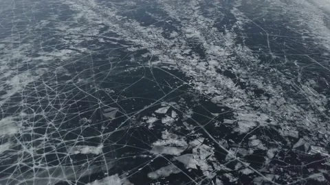 Aerial view of dark ice texture frozen lake Baikal winter Olkhon Siberia Russia Stock Footage 131703089