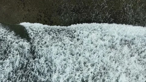 Aerial view of dark ocean waves with white wash. Stock Footage 231387664