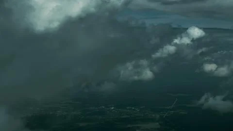 Aerial View of Dark Storm Clouds and Overcast Landscape Below 스톡 사진