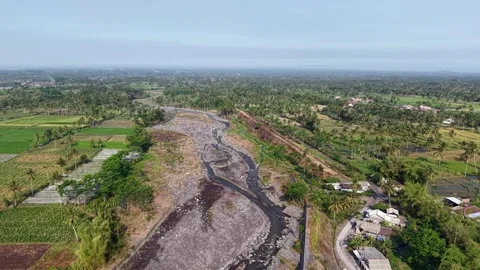Aerial view of a dark volcanic lahar cold lava flow river Stock Footage 346254501