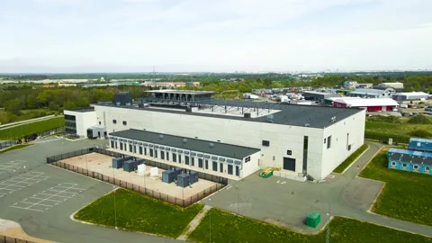 Aerial View of an Data Center with AI Cloud Computing Infrastructure and Servers Stock Footage 335634003