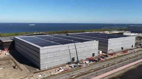 Aerial view of data center construction site with rooftop solar panels Stock Footage 337448305