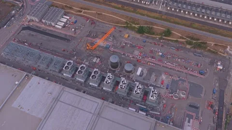 Aerial view of data center construction site with cooling towers Stock Footage 342812713