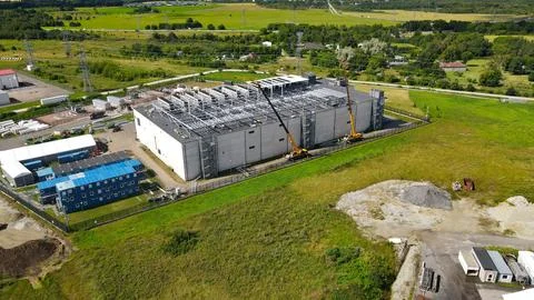 Aerial view of data center construction with cranes installing cooling system Stock Photos