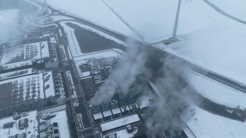 Aerial view of data center cooling systems and wind turbines in winter Stock Footage 327904188