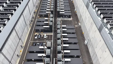 Aerial view of data center with cooling system infrastructure Stock Footage 337810603