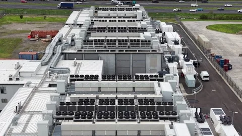Aerial view of data center cooling system and highway traffic Stock Footage 340503577