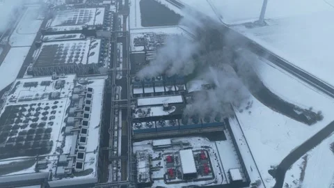 Aerial view of data center emitting steam in winter Stock Footage 327904301