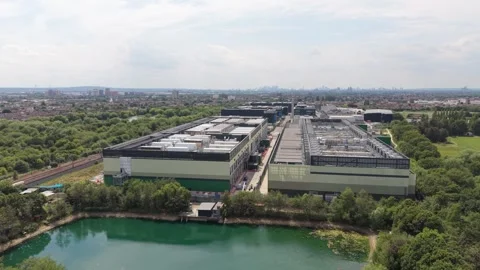 Aerial view of data center facility near a pond, United Kingdom. Stock Footage 337866295