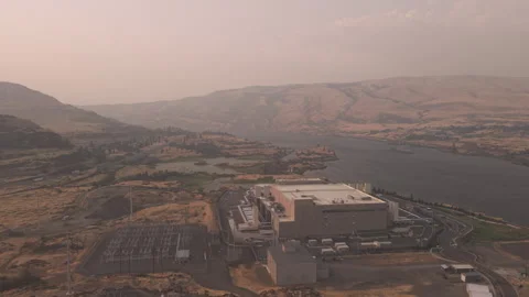 Aerial view of a data center in Oregon next to the Columbia River Stock Footage 345996421