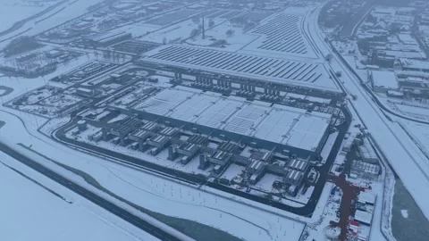 Aerial view of data center with solar panels in snowy winter Stock Footage 327904210