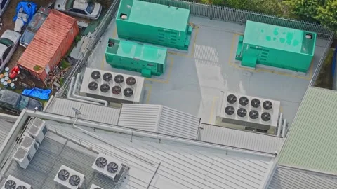 Aerial View of Data Centre Rooftop Generators and Cooling Infrastructure Stock Footage 342047697