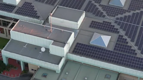 Aerial view of data centre rooftop with solar panels at dusk Stock Footage 348043880