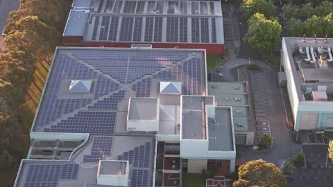 Aerial view of data centre with solar panels at dusk Stock Footage 348027569
