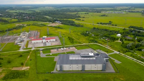 Aerial view of a data centre in summer countryside with a electrical power Stock Footage 313707804