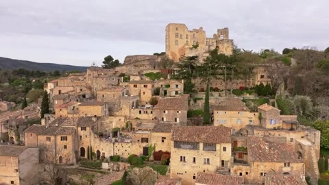 Aerial view of dawn breaking over Lacoste and Marquis de Sade chateau Stock Footage 313150825