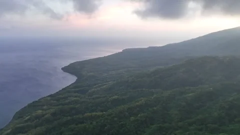 Aerial View of Dawn Clouds Drifting Over Coast of Indonesian Volcano Video stock 248265658