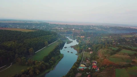 Aerial view of the dawn over the river in the fog Video stock 118980561
