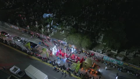 Aerial View of Day of the Dead Parade with Illuminated Floats at Night. Stock Footage 337909262