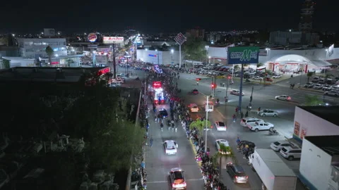 Aerial View of Day of the Dead Parade at Night with Crowds and Floats. Stock Footage 337910076