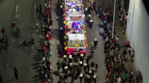 Aerial View of Day of the Dead Parade Float with Marching Band at Night. Video stock 337910761