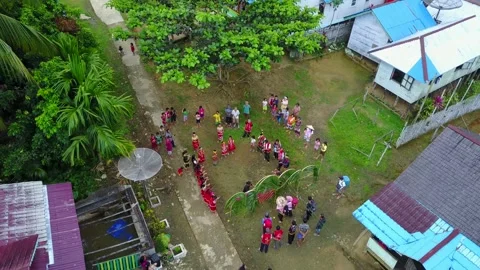 AERIAL VIEW DAYAK TRIBE WHEN WELCOMING GUESTS WEST KALIMANTAN INDONESIA Stock Footage 231858392