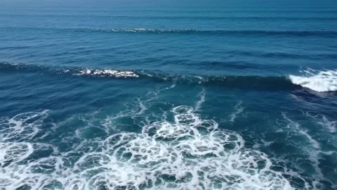 Aerial view of deep blue ocean waves crashing with white foam creating abst.. Stock Footage 321434761