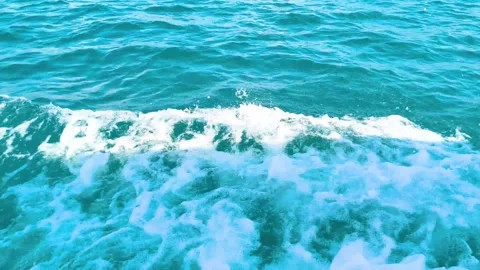 Aerial view of deep blue ocean surface with white foam waves Stock Footage 340533271