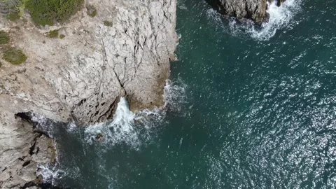Aerial View of Deep Blue Water and Rugged Shoreline Stock Footage 291298521