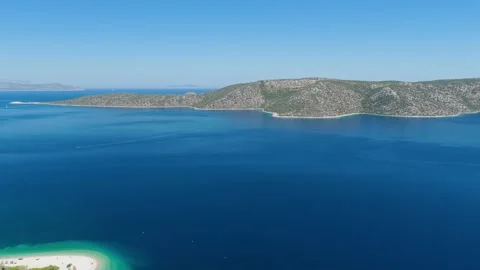 Aerial view of the deep blue waters and rugged coastline of Peristera Island Stock Footage 346714912