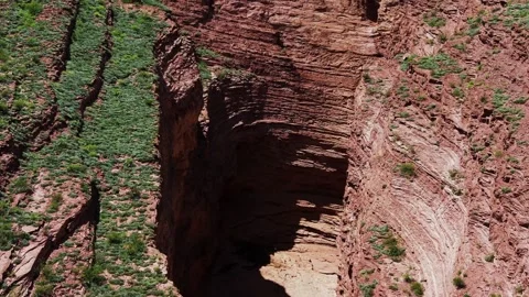 Aerial view of deep canyon gorge with rock layers, Argentina Stock Footage 332284068