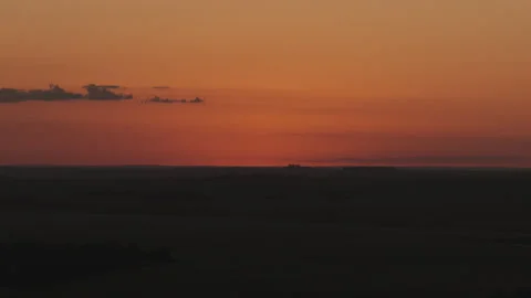 Aerial View of Deep Orange Sunset Sky Over Dark Farmland Silhouette 動画素材 346070102