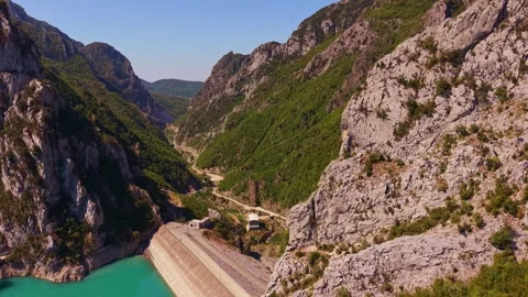 Aerial View of a Deep Rocky Mountain Canyon with a Winding Road Stock Footage 341394981