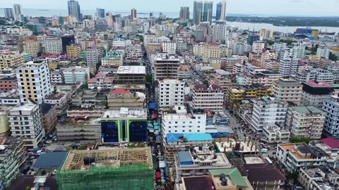 Aerial view of a dense cityscape with various buildings and skyscrapers in the Stock Footage 313315563