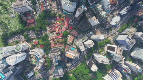 Aerial view of dense downtown grid with towers, parks and winding avenues in Stock Footage 327123244
