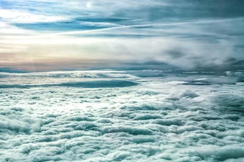 Aerial view dense layer of fluffy white cumulus clouds stretching to horizon Stock Photos