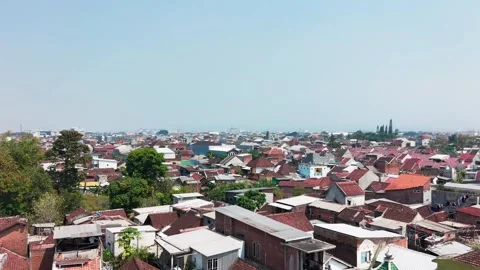 Aerial view of a dense, quiet town with red-tiled roofs Stock Footage 339901657