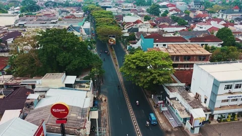 Aerial view of a dense, quiet town with red tiled roofs Stock Footage 340704711